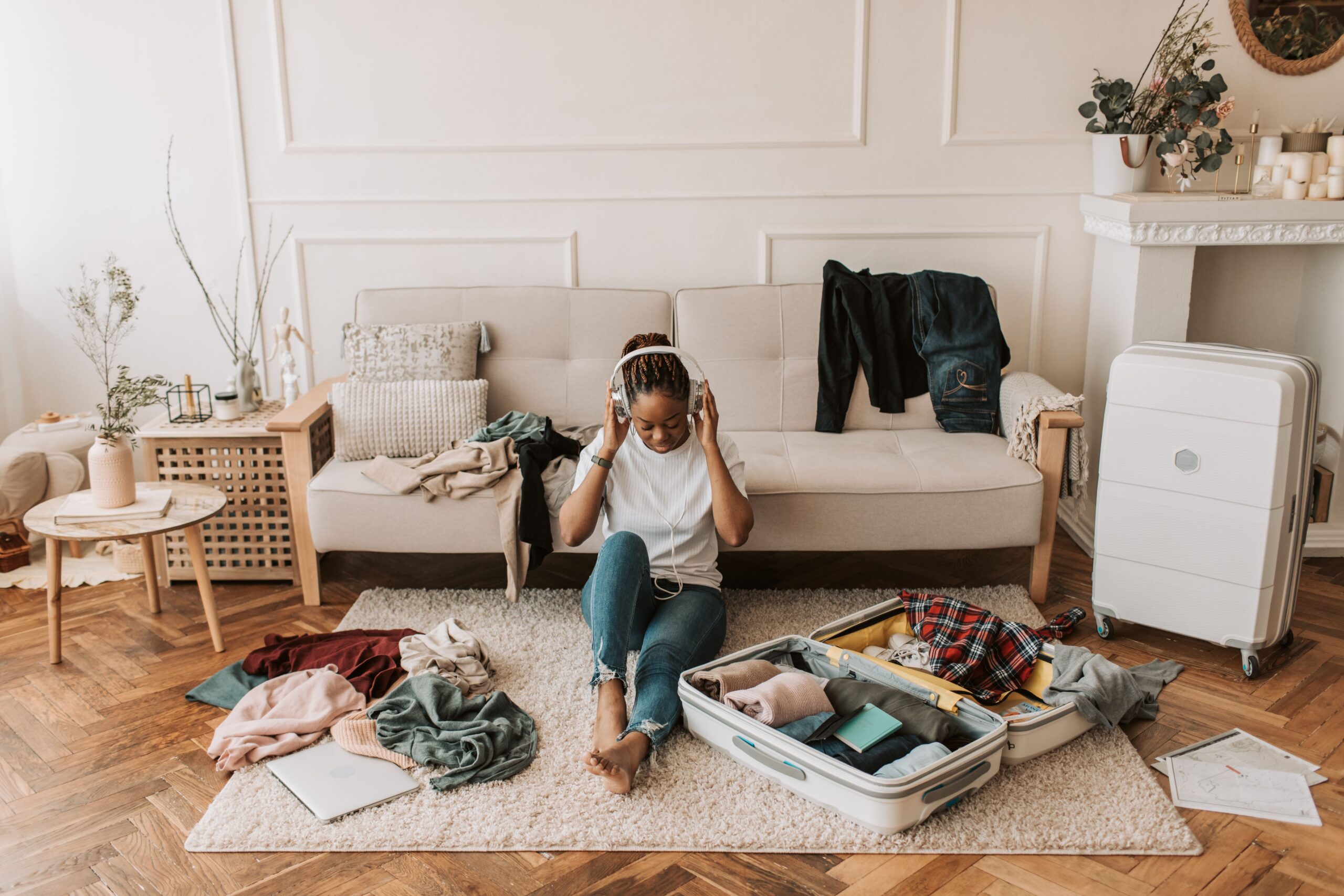Woman packing a suitcase at home, preparing for a weekend companionship trip