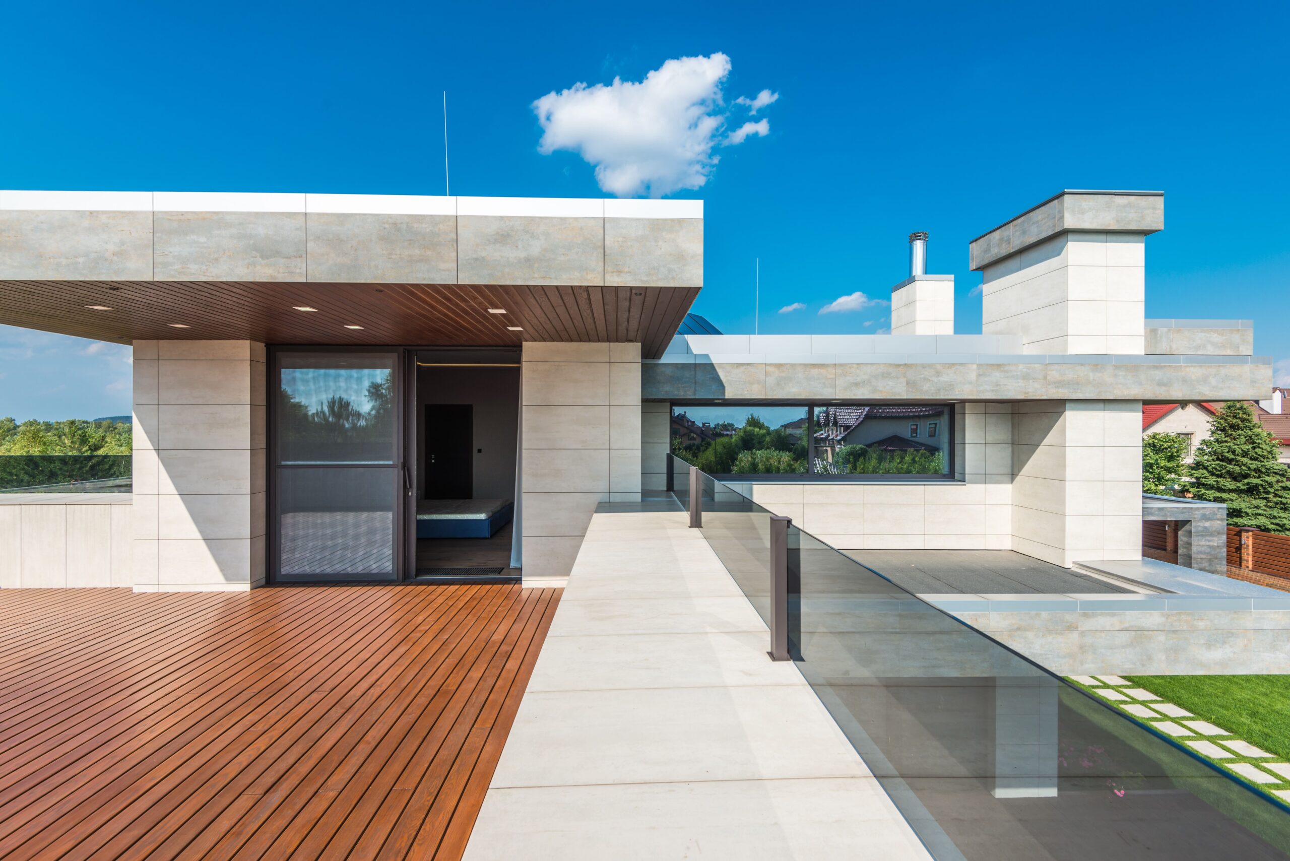 Sleek modern terrace with linear decking and open blue-sky views, illustrating contemporary outdoor deck design.
